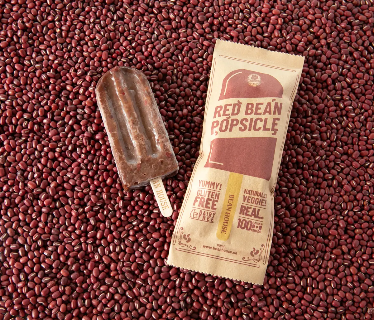 A red bean popsicle and its wrapper on a bed of adzuki beans (photograph supplied by the client)