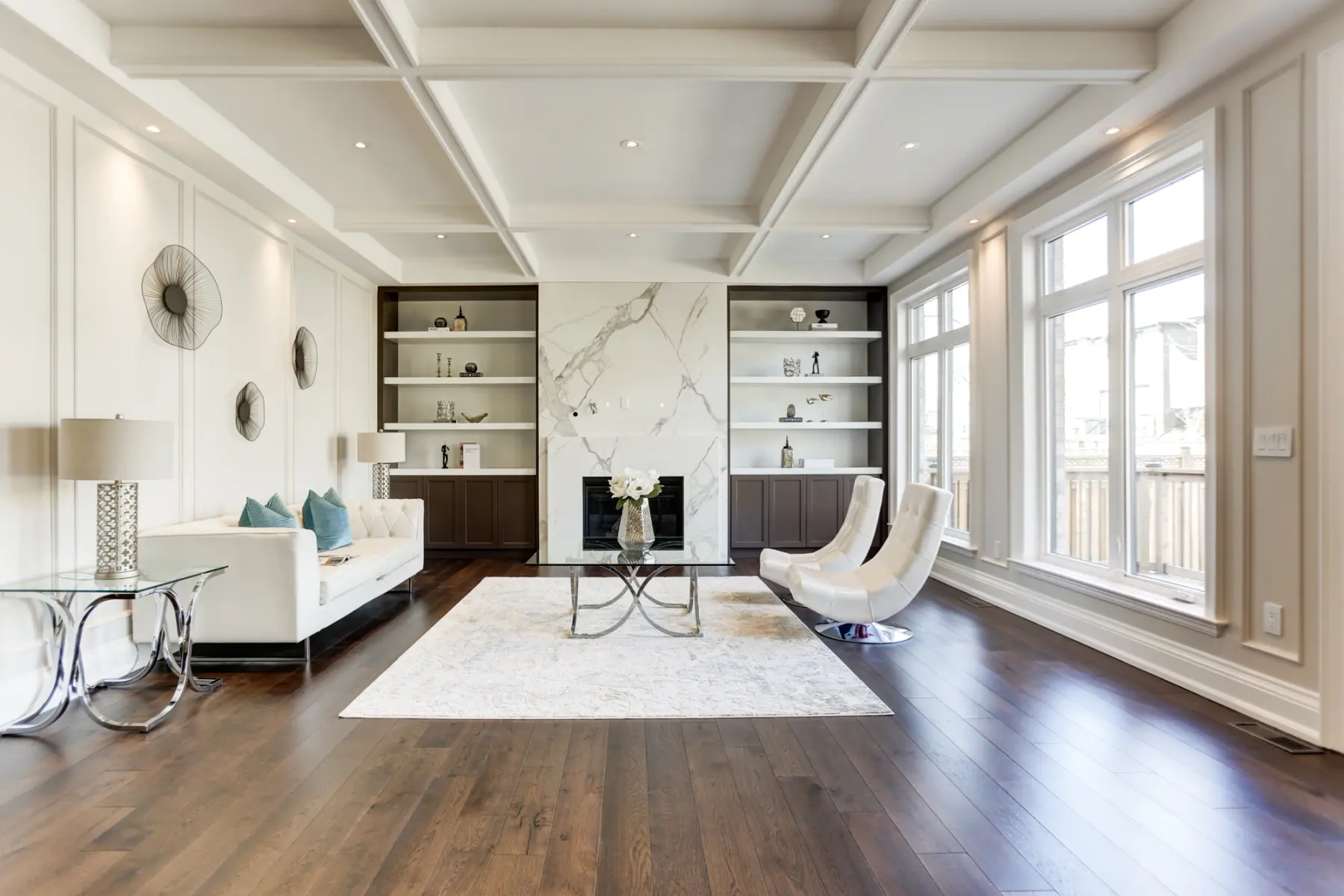 Living room in a Toronto home: coffered ceiling and marble fireplace