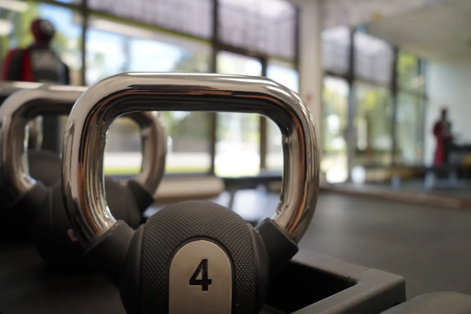 A 4 kg kettlebell close up against bright windows