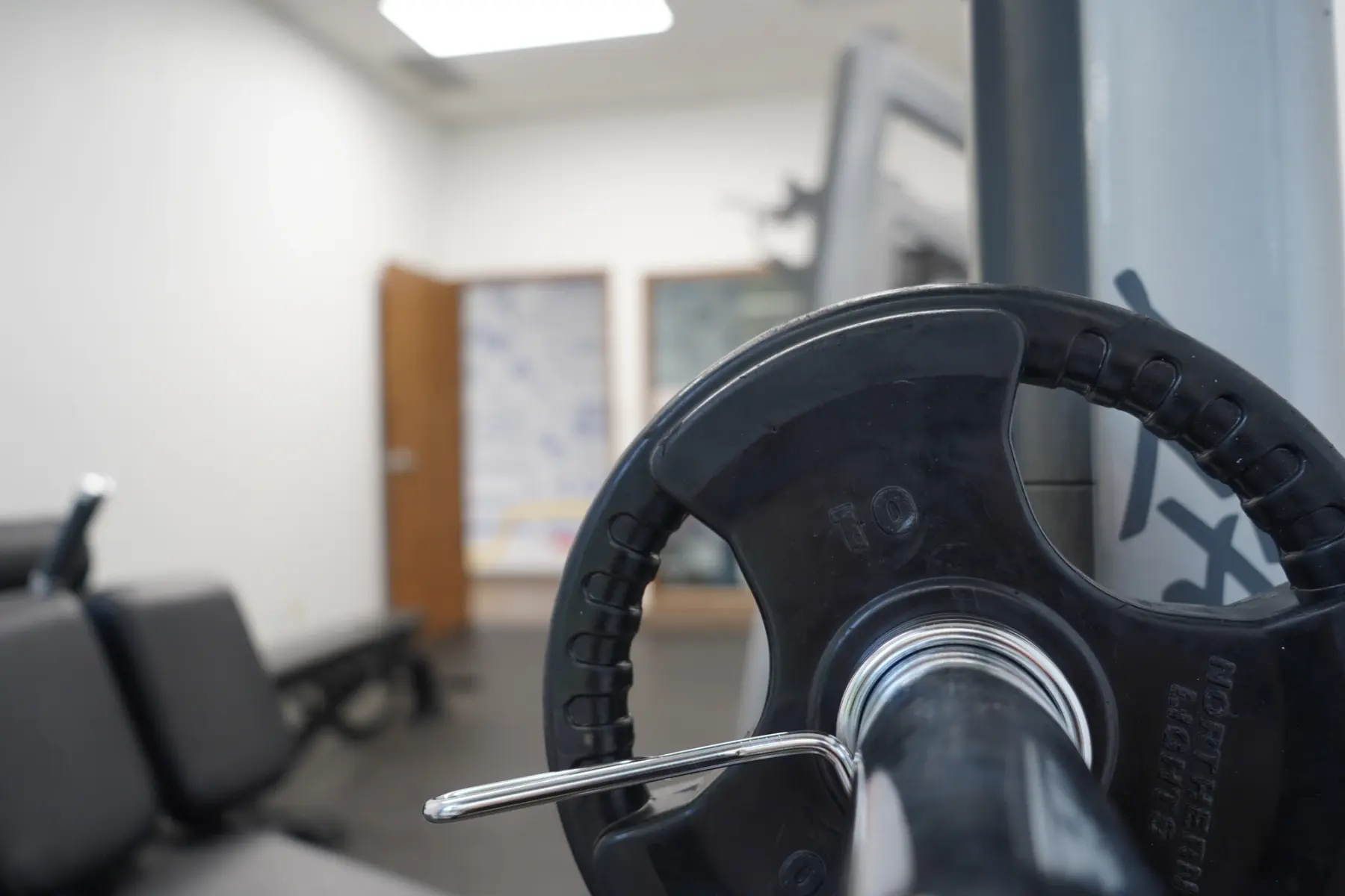A weight plate on a bar, close up