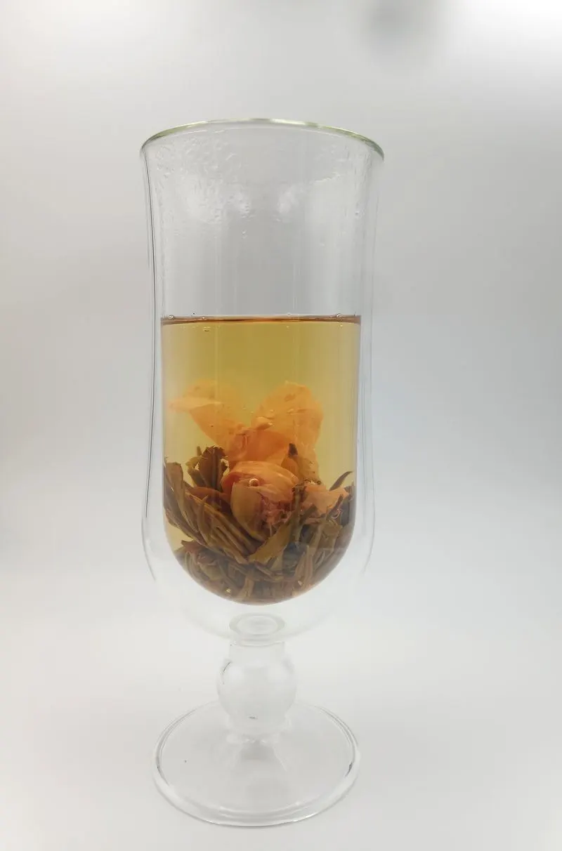 Aurora brewed: the flower open in a glass