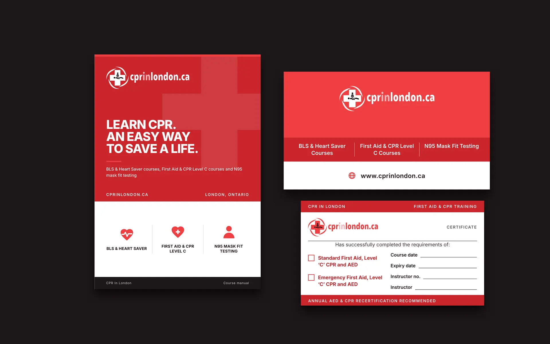 The course-manual cover, a certificate card and the business card on a dark table