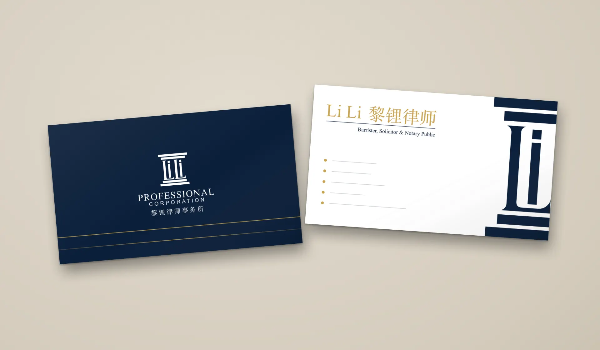 The Li Li business card, front and back, on a stone-coloured table: the white portico and two gold rules on navy; the gold name on white