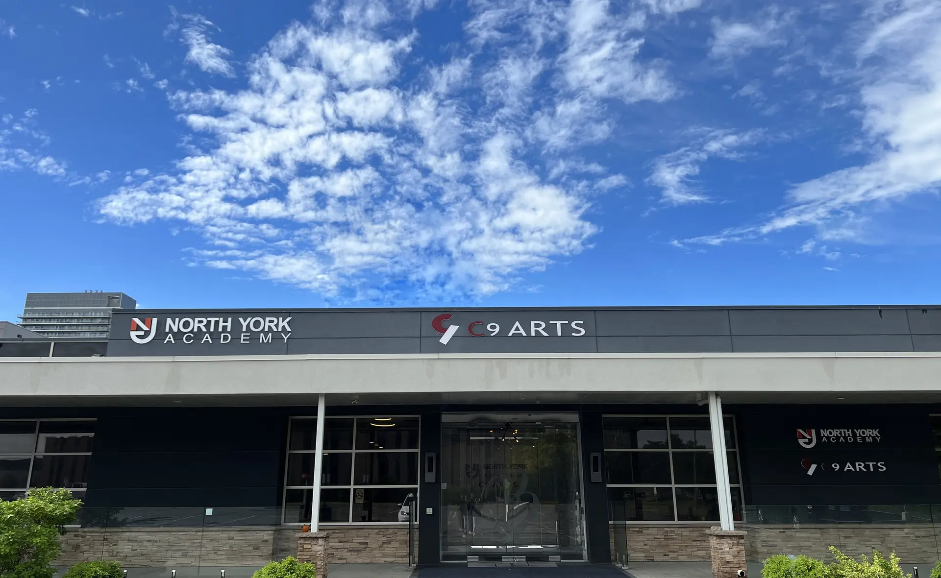 The North York Academy building, with the NORTH YORK ACADEMY and C9 ARTS signs over the entrance