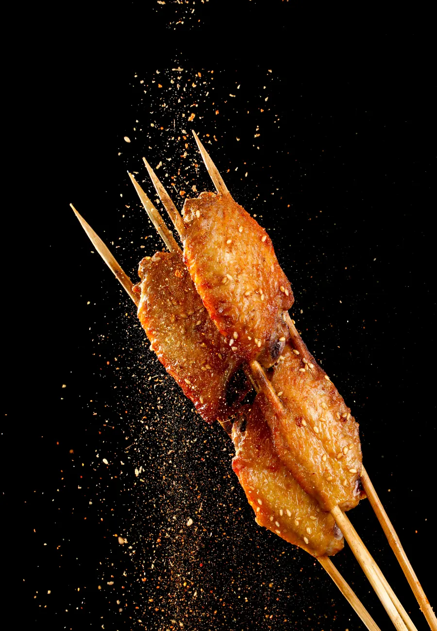 Chicken wing skewers with sesame and chilli falling