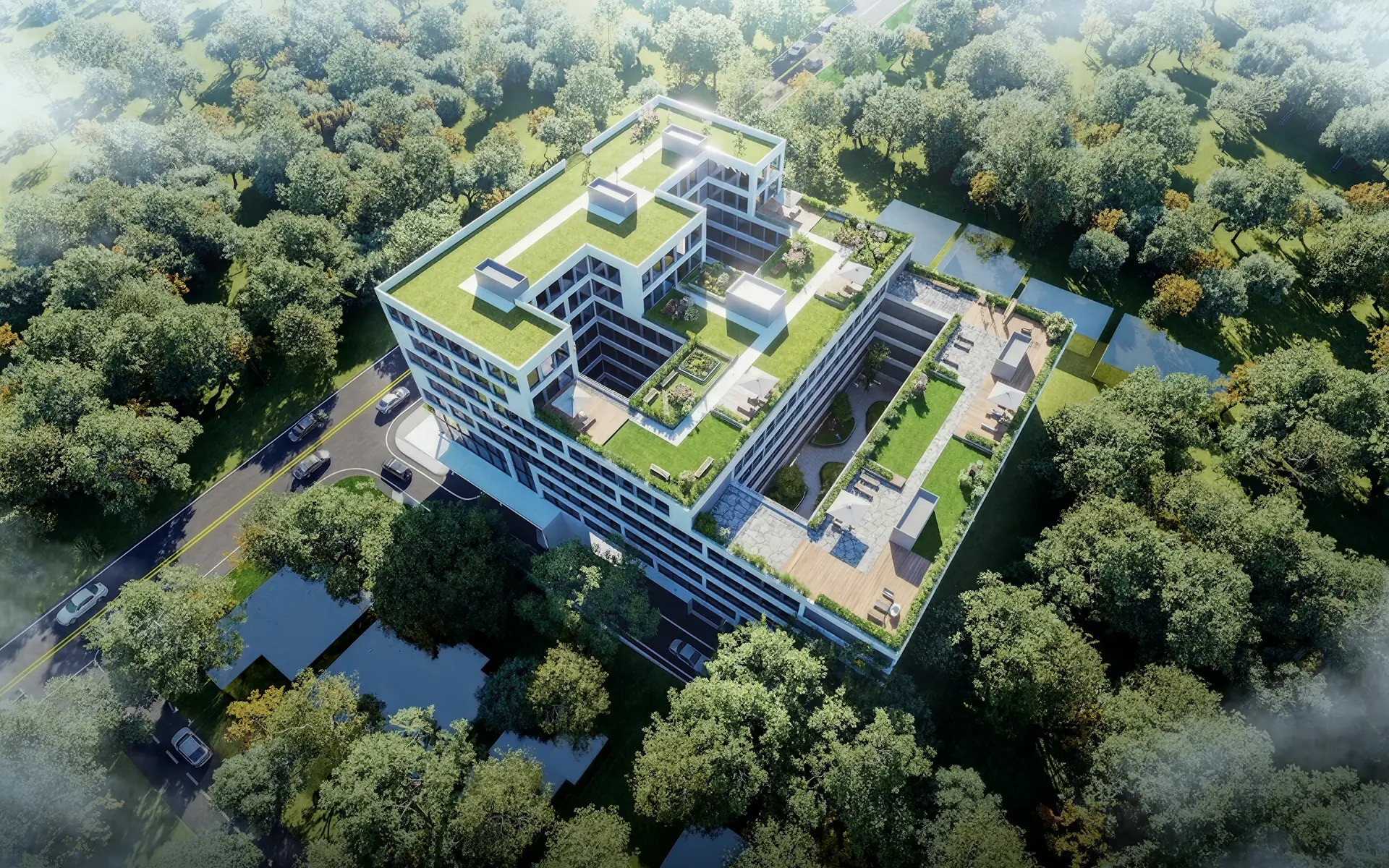 Sarnia Residence from above: a white building and its roof gardens among the trees