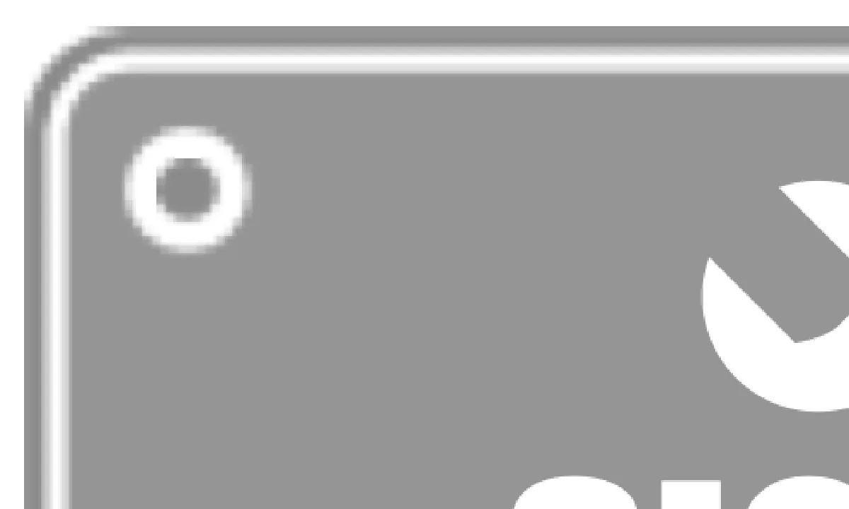 Top-left corner of the sampler mark, enlarged: the plate edge and fixing point are a soft bitmap, the spanner edge is sharp