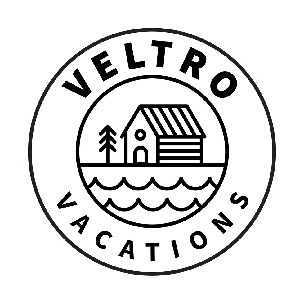 Direction four: a round badge, lettering ringed around the cabin and two rows of waves