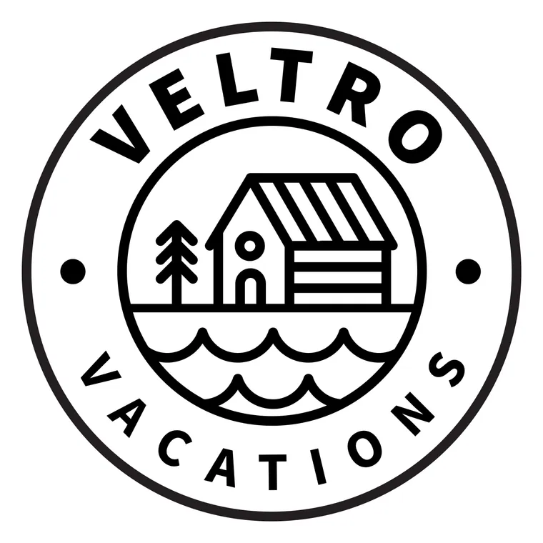 Badge variation: a bold VELTRO, side dots, two rows of waves