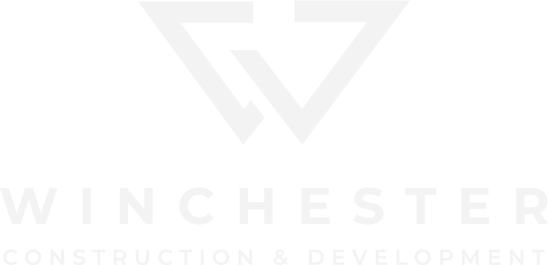 Winchester Construction & Development logo, reversed