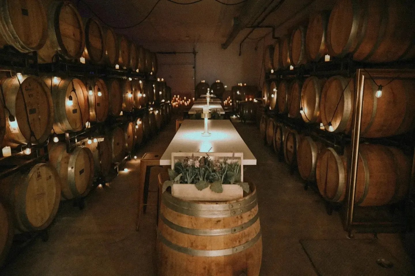 Alvento’s barrel cellar, a long table lit with candles