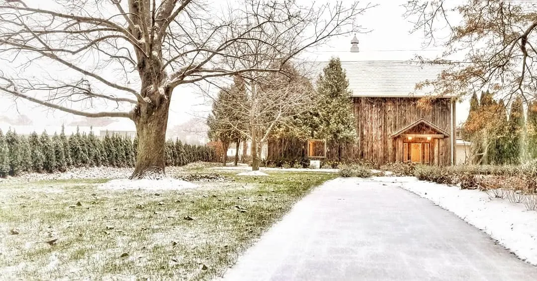 The snowy drive to the barn in winter